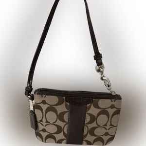 NWOT Coach Signature C Small Wristlet in "Khaki/Mahogany"
*Measures 6" × 4"